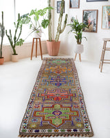 Vintage Turkish runner rug in a living room setting, pile rug, Turkish rug, vintage rug, portland, rug shop, bright colors, wild shaman, soft rug, bold color, Portland, Oregon, rug store, rug shop, local shop, antique rug