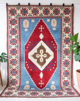 Vintage Turkish rug in a living room setting, pile rug, Turkish rug, vintage rug, portland, rug shop, bright colors, wild shaman, soft rug, bold color, Portland, Oregon, rug store, rug shop, local shop