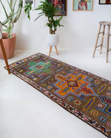 Vintage Turkish runner rug in a living room setting, pile rug, Turkish rug, vintage rug, portland, rug shop, bright colors, wild shaman, soft rug, bold color, Portland, Oregon, rug store, rug shop, local shop, antique rug
