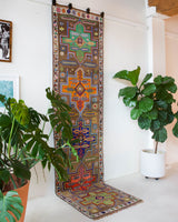 Vintage Turkish runner rug in a living room setting, pile rug, Turkish rug, vintage rug, portland, rug shop, bright colors, wild shaman, soft rug, bold color, Portland, Oregon, rug store, rug shop, local shop, antique rug