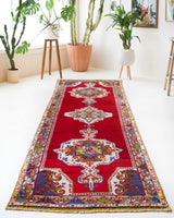 Vintage Turkish runner rug in a living room setting, pile rug, Turkish rug, vintage rug, portland, rug shop, bright colors, wild shaman, soft rug, bold color, Portland, Oregon, rug store, rug shop, local shop, antique rug