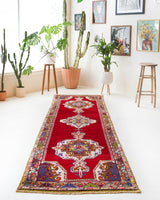 Vintage Turkish runner rug in a living room setting, pile rug, Turkish rug, vintage rug, portland, rug shop, bright colors, wild shaman, soft rug, bold color, Portland, Oregon, rug store, rug shop, local shop, antique rug
