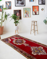 Vintage Turkish runner rug in a living room setting, pile rug, Turkish rug, vintage rug, portland, rug shop, bright colors, wild shaman, soft rug, bold color, Portland, Oregon, rug store, rug shop, local shop, antique rug