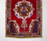 Vintage Turkish runner rug in a living room setting, pile rug, Turkish rug, vintage rug, portland, rug shop, bright colors, wild shaman, soft rug, bold color, Portland, Oregon, rug store, rug shop, local shop, antique rug