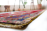 Vintage Turkish runner rug in a living room setting, pile rug, Turkish rug, vintage rug, portland, rug shop, bright colors, wild shaman, soft rug, bold color, Portland, Oregon, rug store, rug shop, local shop, antique rug