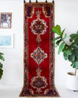Vintage Turkish runner rug in a living room setting, pile rug, Turkish rug, vintage rug, portland, rug shop, bright colors, wild shaman, soft rug, bold color, Portland, Oregon, rug store, rug shop, local shop, antique rug