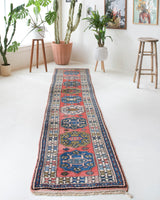 Vintage Turkish runner rug in living room setting, old rug, antique rug, pastel colors, faded colors, Turkish rug, vintage rug, soft rug, Portland, Oregon, rug store, rug shop, local shop