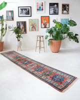 Vintage Turkish runner rug in living room setting, old rug, antique rug, pastel colors, faded colors, Turkish rug, vintage rug, soft rug, Portland, Oregon, rug store, rug shop, local shop