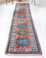 Vintage Turkish runner rug in living room setting, old rug, antique rug, pastel colors, faded colors, Turkish rug, vintage rug, soft rug, Portland, Oregon, rug store, rug shop, local shop