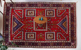 Vintage Turkish rug in a living room setting, pile rug, Turkish rug, vintage rug, portland, rug shop, bright colors, wild shaman, soft rug, bold color, Portland, Oregon, rug store, rug shop, local shop