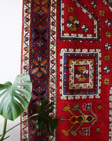Vintage Turkish rug in a living room setting, pile rug, Turkish rug, vintage rug, portland, rug shop, bright colors, wild shaman, soft rug, bold color, Portland, Oregon, rug store, rug shop, local shop