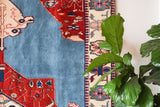 Vintage Turkish rug in a living room setting, pile rug, Turkish rug, vintage rug, portland, rug shop, bright colors, wild shaman, soft rug, bold color, Portland, Oregon, rug store, rug shop, local shop