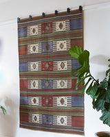 Vintage kilim rug in living room setting, old rug, antique rug, pastel colors, faded colors, Turkish rug, vintage rug, soft rug, Portland, Oregon, rug store, rug shop, local shop, earthy tones, earthy colors, warm colors