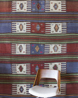 Vintage kilim rug in living room setting, old rug, antique rug, pastel colors, faded colors, Turkish rug, vintage rug, soft rug, Portland, Oregon, rug store, rug shop, local shop, earthy tones, earthy colors, warm colors