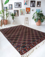 Vintage kilim rug in room decor setting, old rug, antique rug, pastel colors, faded colors, Turkish rug, vintage rug, soft rug, Portland, Oregon, rug store, rug shop, local shop, bold colors, bright colors, faded colors