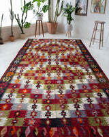 Vintage kilim rug in room decor setting, old rug, antique rug, pastel colors, faded colors, Turkish rug, vintage rug, soft rug, Portland, Oregon, rug store, rug shop, local shop, bold colors, bright colors, faded colors