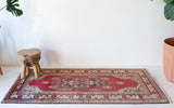Vintage Turkish runner rug in living room setting, old rug, antique rug, pastel colors, faded colors, Turkish rug, vintage rug, soft rug, Portland, Oregon, rug store, rug shop, local shop