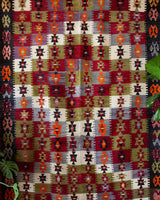 Vintage kilim rug in room decor setting, old rug, antique rug, pastel colors, faded colors, Turkish rug, vintage rug, soft rug, Portland, Oregon, rug store, rug shop, local shop, bold colors, bright colors, faded colors