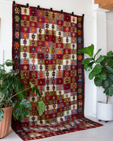 Vintage kilim rug in room decor setting, old rug, antique rug, pastel colors, faded colors, Turkish rug, vintage rug, soft rug, Portland, Oregon, rug store, rug shop, local shop, bold colors, bright colors, faded colors