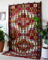 Vintage kilim rug in room decor setting, old rug, antique rug, pastel colors, faded colors, Turkish rug, vintage rug, soft rug, Portland, Oregon, rug store, rug shop, local shop, bold colors, bright colors, faded colors