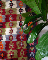 Vintage kilim rug in room decor setting, old rug, antique rug, pastel colors, faded colors, Turkish rug, vintage rug, soft rug, Portland, Oregon, rug store, rug shop, local shop, bold colors, bright colors, faded colors