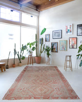 Vintage kilim rug in living room setting, old rug, antique rug, pastel colors, faded colors, Turkish rug, vintage rug, soft rug, Portland, Oregon, rug store, rug shop, local shop, earthy tones, earthy colors, warm colors