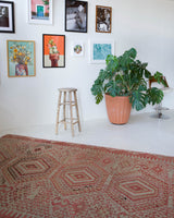 Vintage kilim rug in living room setting, old rug, antique rug, pastel colors, faded colors, Turkish rug, vintage rug, soft rug, Portland, Oregon, rug store, rug shop, local shop, earthy tones, earthy colors, warm colors