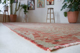 Vintage kilim rug in living room setting, old rug, antique rug, pastel colors, faded colors, Turkish rug, vintage rug, soft rug, Portland, Oregon, rug store, rug shop, local shop, earthy tones, earthy colors, warm colors