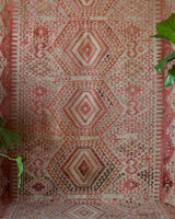 Vintage kilim rug in living room setting, old rug, antique rug, pastel colors, faded colors, Turkish rug, vintage rug, soft rug, Portland, Oregon, rug store, rug shop, local shop, earthy tones, earthy colors, warm colors