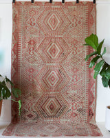 Vintage kilim rug in living room setting, old rug, antique rug, pastel colors, faded colors, Turkish rug, vintage rug, soft rug, Portland, Oregon, rug store, rug shop, local shop, earthy tones, earthy colors, warm colors