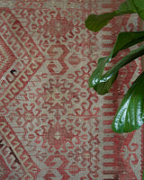 Vintage kilim rug in living room setting, old rug, antique rug, pastel colors, faded colors, Turkish rug, vintage rug, soft rug, Portland, Oregon, rug store, rug shop, local shop, earthy tones, earthy colors, warm colors