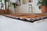 Vintage kilim rug in living room setting, bright colors, wild shaman, soft rug, bold color, Portland, Oregon, rug store, rug shop, local shop, vintage rug, modern kilim, warm colors