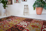 Vintage kilim rug in living room setting, bright colors, wild shaman, soft rug, bold color, Portland, Oregon, rug store, rug shop, local shop, vintage rug, modern kilim, warm colors