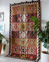 Vintage kilim rug in living room setting, bright colors, wild shaman, soft rug, bold color, Portland, Oregon, rug store, rug shop, local shop, vintage rug, modern kilim, warm colors