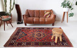Vintage Turkish rug in a living room setting, pile rug, Turkish rug, vintage rug, portland, rug shop, bright colors, wild shaman, soft rug, bold color, Portland, Oregon, rug store, rug shop, local shop, antique rug