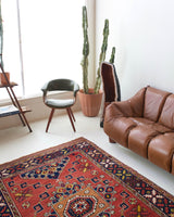 Vintage Turkish rug in a living room setting, pile rug, Turkish rug, vintage rug, portland, rug shop, bright colors, wild shaman, soft rug, bold color, Portland, Oregon, rug store, rug shop, local shop, antique rug