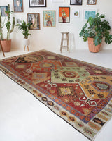 Vintage kilim rug in room decor setting, old rug, antique rug, pastel colors, faded colors, Turkish rug, vintage rug, soft rug, Portland, Oregon, rug store, rug shop, local shop, bold colors, bright colors, faded colors