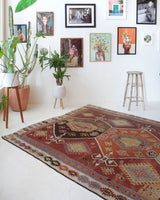 Vintage kilim rug in room decor setting, old rug, antique rug, pastel colors, faded colors, Turkish rug, vintage rug, soft rug, Portland, Oregon, rug store, rug shop, local shop, bold colors, bright colors, faded colors