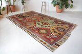Vintage kilim rug in room decor setting, old rug, antique rug, pastel colors, faded colors, Turkish rug, vintage rug, soft rug, Portland, Oregon, rug store, rug shop, local shop, bold colors, bright colors, faded colors