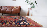 Vintage Turkish rug in a living room setting, pile rug, Turkish rug, vintage rug, portland, rug shop, bright colors, wild shaman, soft rug, bold color, Portland, Oregon, rug store, rug shop, local shop, antique rug