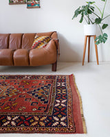 Vintage Turkish rug in a living room setting, pile rug, Turkish rug, vintage rug, portland, rug shop, bright colors, wild shaman, soft rug, bold color, Portland, Oregon, rug store, rug shop, local shop, antique rug
