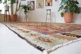 Vintage kilim rug in room decor setting, old rug, antique rug, pastel colors, faded colors, Turkish rug, vintage rug, soft rug, Portland, Oregon, rug store, rug shop, local shop, bold colors, bright colors, faded colors