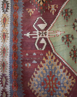 Vintage kilim rug in room decor setting, old rug, antique rug, pastel colors, faded colors, Turkish rug, vintage rug, soft rug, Portland, Oregon, rug store, rug shop, local shop, bold colors, bright colors, faded colors