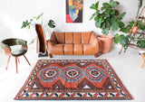 Vintage Turkish rug in a living room setting, pile rug, Turkish rug, vintage rug, portland, rug shop, bright colors, wild shaman, soft rug, bold color, Portland, Oregon, rug store, rug shop, local shop, antique rug