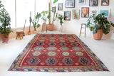 Vintage Turkish rug in a living room setting, pile rug, Turkish rug, vintage rug, portland, rug shop, bright colors, wild shaman, soft rug, bold color, Portland, Oregon, rug store, rug shop, local shop, antique rug