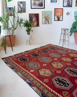 Vintage Turkish rug in a living room setting, pile rug, Turkish rug, vintage rug, portland, rug shop, bright colors, wild shaman, soft rug, bold color, Portland, Oregon, rug store, rug shop, local shop, antique rug