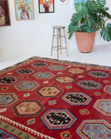 Vintage Turkish rug in a living room setting, pile rug, Turkish rug, vintage rug, portland, rug shop, bright colors, wild shaman, soft rug, bold color, Portland, Oregon, rug store, rug shop, local shop, antique rug