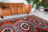 Vintage Turkish rug in a living room setting, pile rug, Turkish rug, vintage rug, portland, rug shop, bright colors, wild shaman, soft rug, bold color, Portland, Oregon, rug store, rug shop, local shop, antique rug