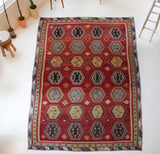 Vintage Turkish rug in a living room setting, pile rug, Turkish rug, vintage rug, portland, rug shop, bright colors, wild shaman, soft rug, bold color, Portland, Oregon, rug store, rug shop, local shop, antique rug