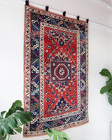 Vintage Turkish rug in living room setting, old rug, antique rug, pastel colors, faded colors, Turkish rug, vintage rug, soft rug, Portland, Oregon, rug store, rug shop, local shop